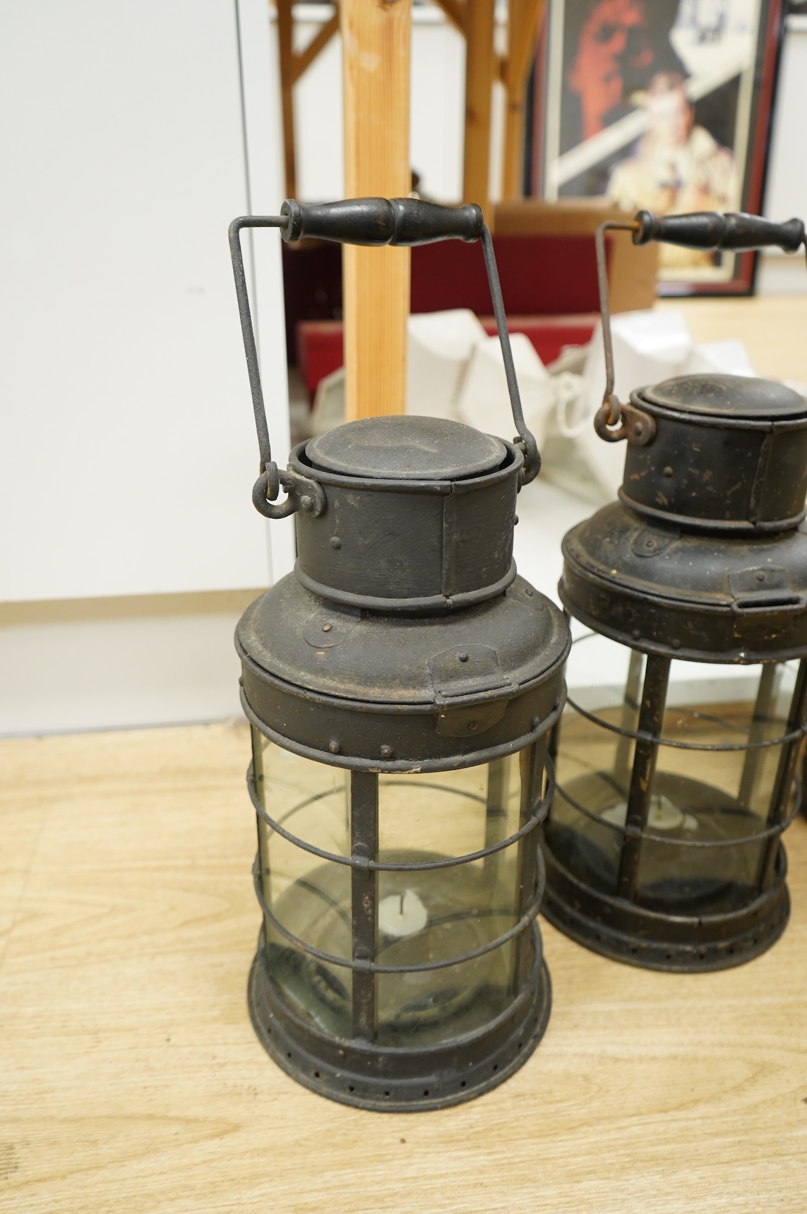 A pair of early 20th century railway hanging lanterns and one other, largest each 45cm high including swing handle